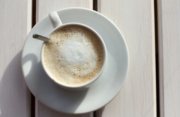 delicious coffee/cup of coffee with a delicate milk foam