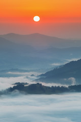 Fototapeta premium Carpathian Mountains. Mountains covered in mist at sunrise