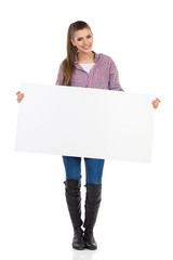 Cheerful Casual Girl Presenting Poster