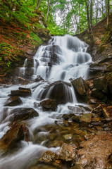 Fototapeta na wymiar Carpathian Mountains. Waterfall Shipot, mountain river