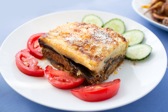Delicious Greek moussaka with aubergine and vegetable salad 