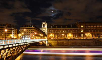 Fototapeta na wymiar River Seine night view with Notre Dame cathedral in the background