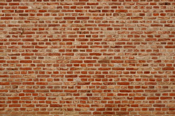 Fototapeta na wymiar Brick wall horizontal background with red, orange and brown bricks