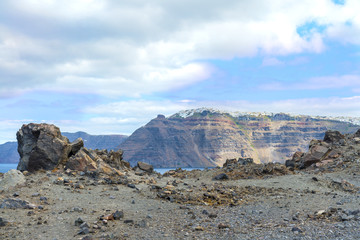 The picturesque view from the volcano to the town of Fira.White stone traditional Greek architecture on the cliffs above the Mediterranean sea.Caldera of Santorini(Thira) island.Cyclades.Greece.Europe