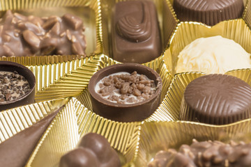 Mixed types of chocolate pralines in a box