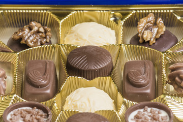 Chocolate pralines of various types in a box