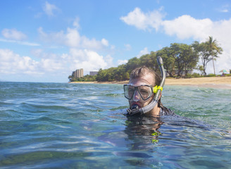 Man Snorkeling on a tropical island 