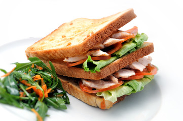 toast with chicken, tomatoes, lettuce and arugula salad on white plate, isolated on white background