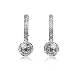 Pair of diamond earrings, isolated on white