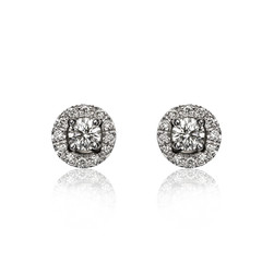 Pair of diamond earrings, isolated on white