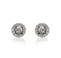 Pair of diamond earrings, isolated on white