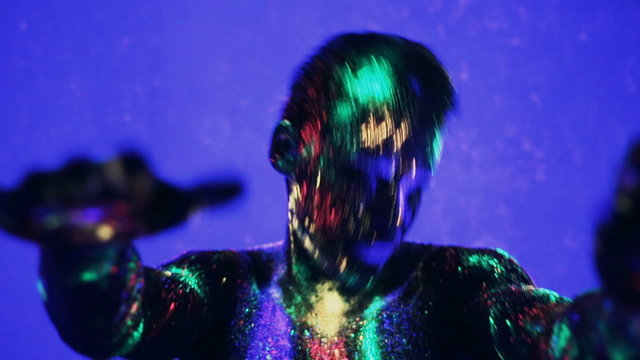 guy dancing in the ultraviolet light