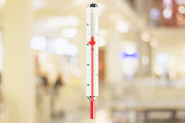 Red mercury arrow decreases in thermometer