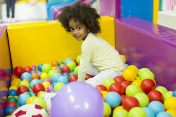 Fototapeta na wymiar Black little girls in the playroom