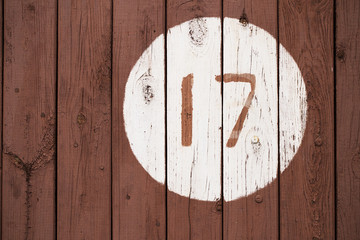 Number 17 on a wooden surface