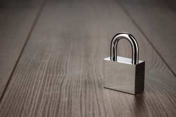 check-lock on the brown wooden table background