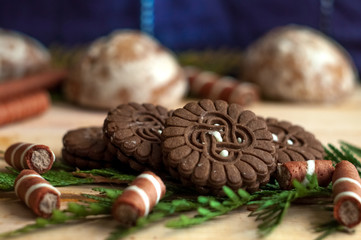Sweet chocolate biscuits, cookies lot to the table. Chocolate rolls with white stripes. Very tasty and sweet.