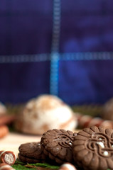 Sweet chocolate biscuits, cookies lot to the table. Chocolate rolls with white stripes. Very tasty and sweet.