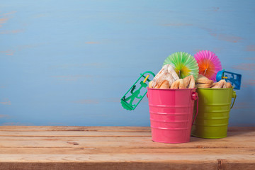Purim traditional gifts with hamantaschen cookies and noisemaker