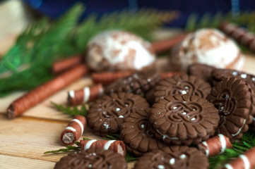 Sweet chocolate biscuits, cookies lot to the table. Chocolate rolls with white stripes. Very tasty and sweet.