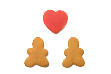 Gingerbread men and a heart on a white background
