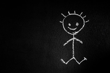 The little man drawn in chalk on a blackboard