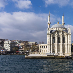 Fototapeta na wymiar picturesque small Ortakoy mosque on the shores of the Bosporus Strait 