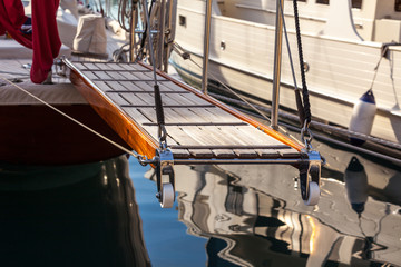 wooden ladder on marine yacht staying in port