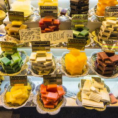 hand made bars of soap stacked for sale in spice market

