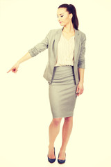 Businesswoman pointing down.