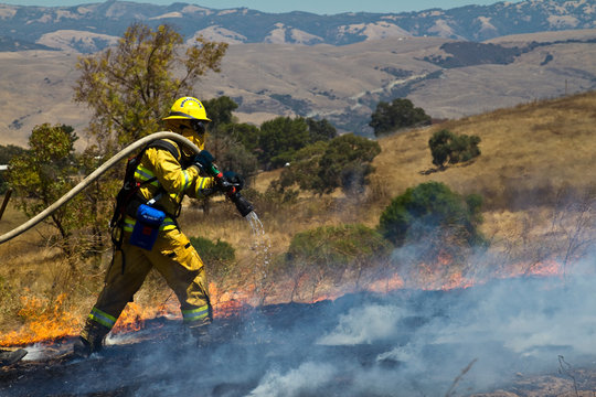 Wildland Firefighter fighting grass fire