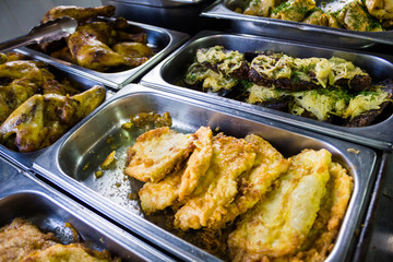 Counters with meat dishes in a cafe