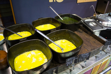 Pots with dumplings on the counter in  cafe