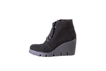 Suede women's boots on a white background, black shoes, autumn and winter, side view