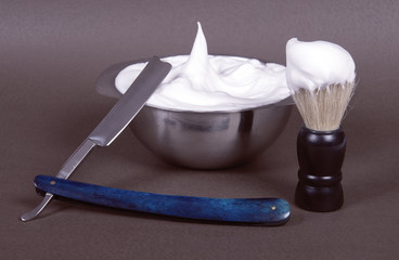 Fototapeta na wymiar a complete shaving-set: razor, shaving brush and a bowl for shav