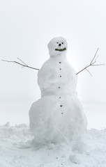 Big snowman waiting for children, winter day