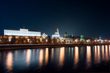 Fototapeta na wymiar View to embankment of the river, Moscow Kremlin and The Ivan the Great Bell-Tower complex from another side of the river in the night, autumn 2015