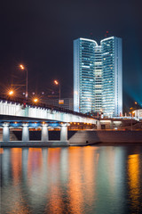 View from another side of the river to the Moscow Government's Building with Novoarbatsky Bridge in the night