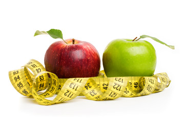 Apples, flowers and measuring tape.