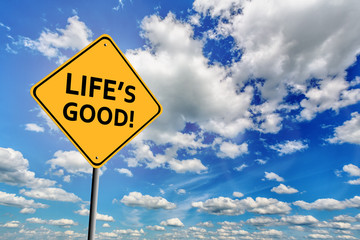Blue cloudy sky and yellow sign