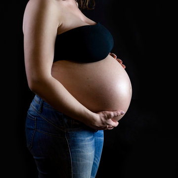 the pregnant on dark background