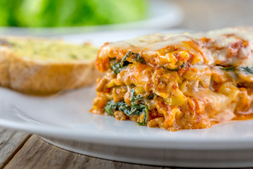 Lasagna with garlic bread and salad