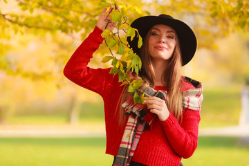 Beautiful woman in autumn park