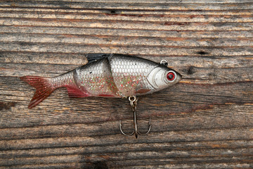 Fishing bait isolated on wooden background
