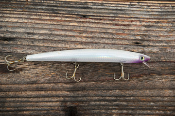Fishing bait isolated on wooden background