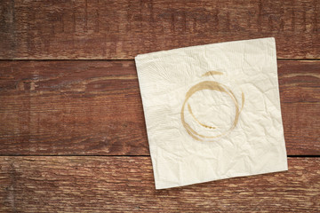 napkin with coffee stains on wood