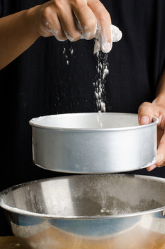 Sifting flour into the bowl,food ingredient,prepare for cooking or baking