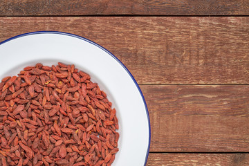 dried goji berries in a white plate
