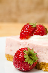 Homemade strawberry cheesecake  on white plate
