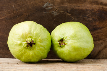 Fresh guava (tropical fruit) on wooden background